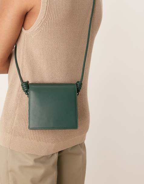 ASOS DESIGN faux leather cross body bag with strap detail in green - view 1