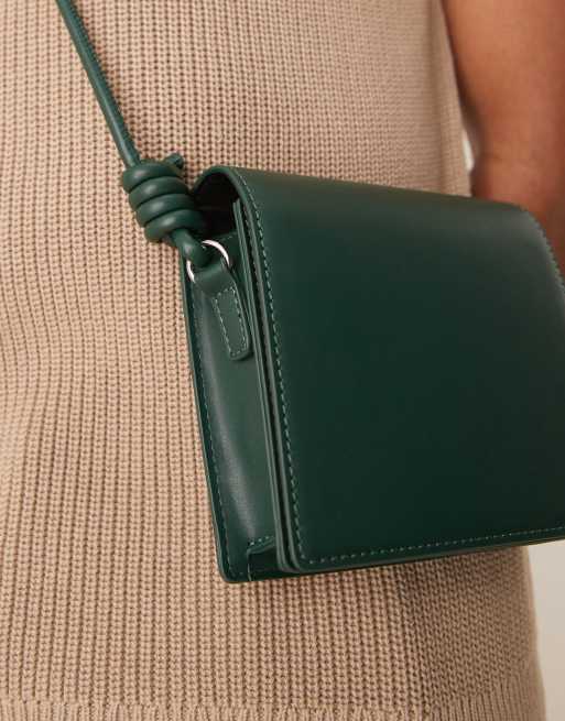 ASOS DESIGN faux leather cross body bag with strap detail in green