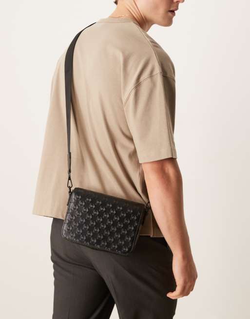 ASOS DESIGN faux leather crossbody bag with monogram emboss detail in black, 3 of 4