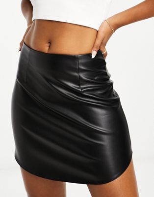 faux leather curved hem mini skirt in black