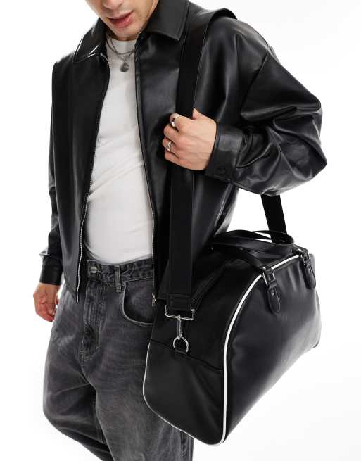 ASOS DESIGN faux leather duffle bag in black with white contrast piping ASOS