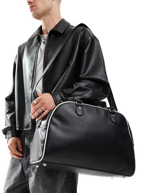 ASOS DESIGN faux leather duffle bag in black with white contrast piping ASOS