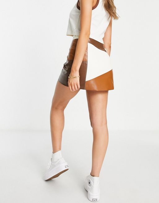 ASOS DESIGN faux leather patchwork mini skirt in brown and cream