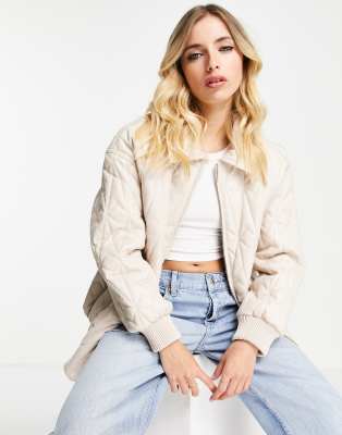 ASOS DESIGN faux leather quilted bomber jacket in cream-White