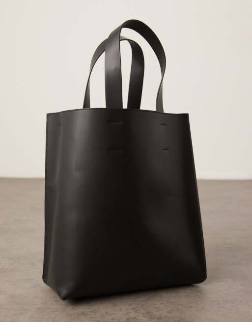 ASOS DESIGN faux leather tote bag with crossbody strap in black, 2 of 4