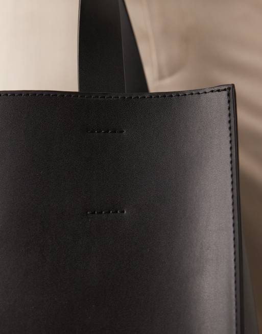 ASOS DESIGN faux leather tote bag with crossbody strap in black, 3 of 4