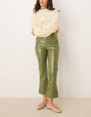 faux leather zip front ankle grazer pants in green croc