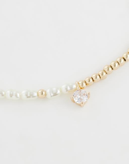 ASOS DESIGN faux pearl and bead bracelet in gold, 2 of 3
