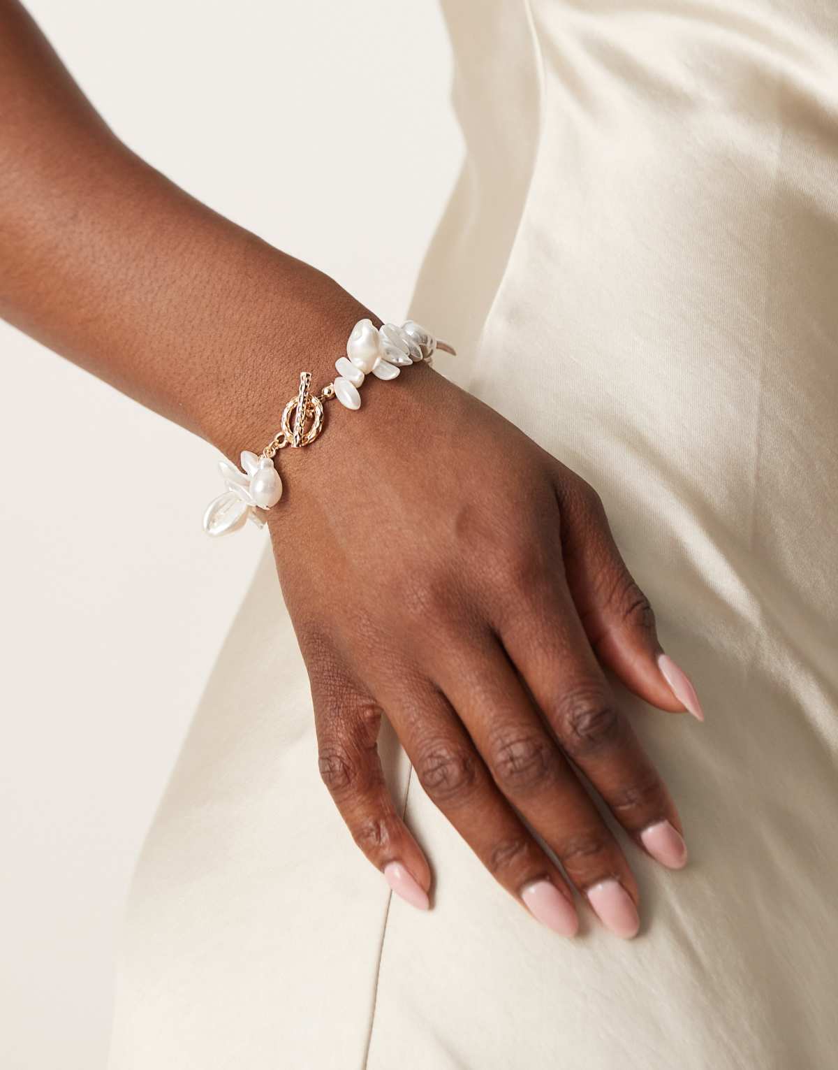 ASOS DESIGN faux pearl bracelet with t-bar detail in gold tone