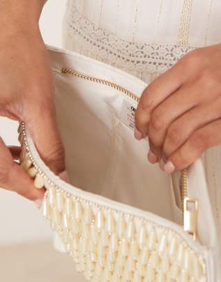 ASOS DESIGN faux pearl droplet zip top clutch bag in cream