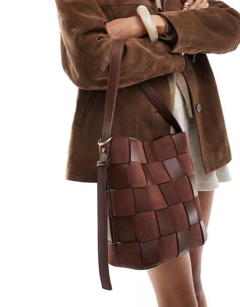 ASOS DESIGN Faux Suede and faux leather weave bucket tote bag in chocolate - view 1
