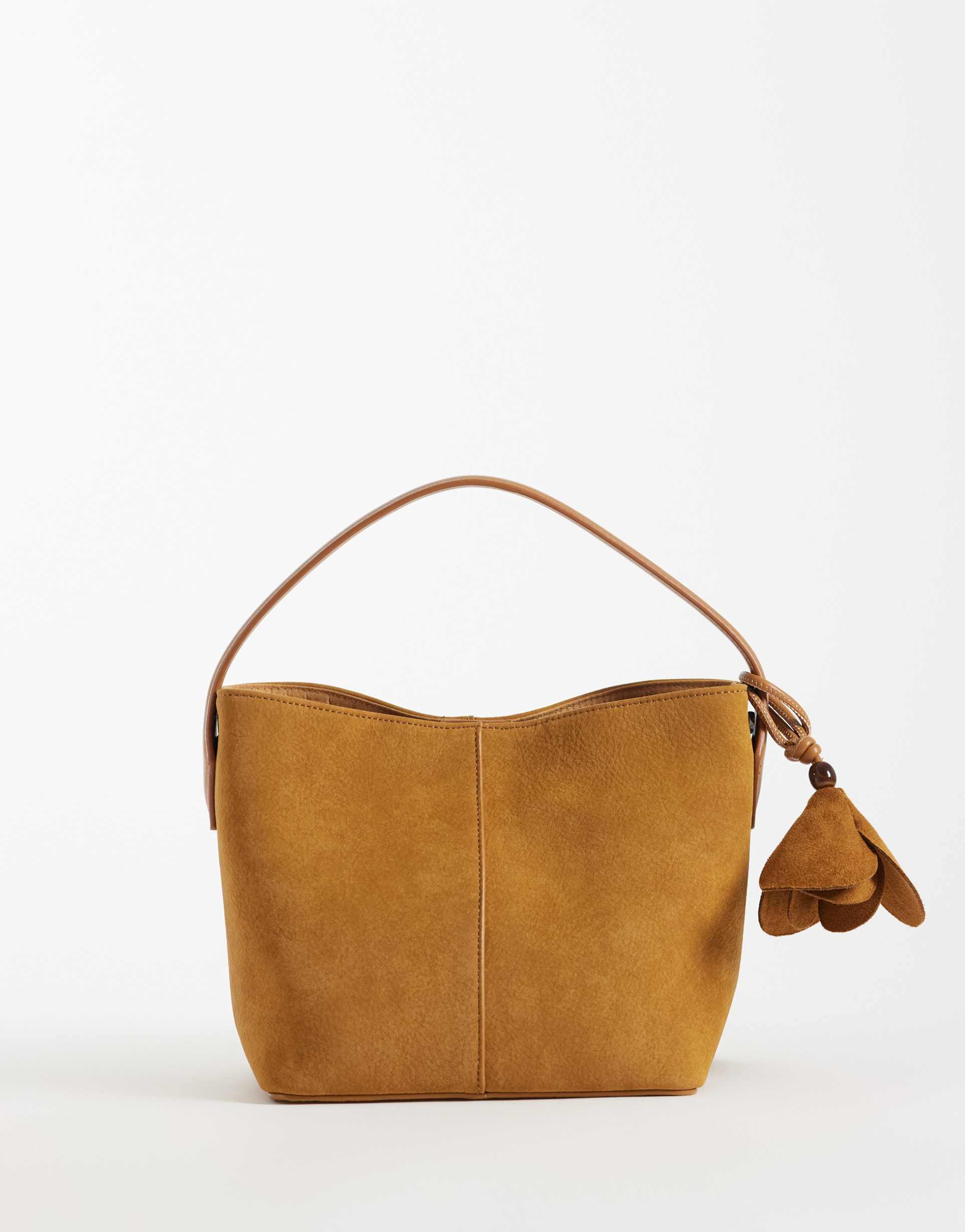 asos design faux suede grab bag in tan with detachable cross body strap with floral bag charm