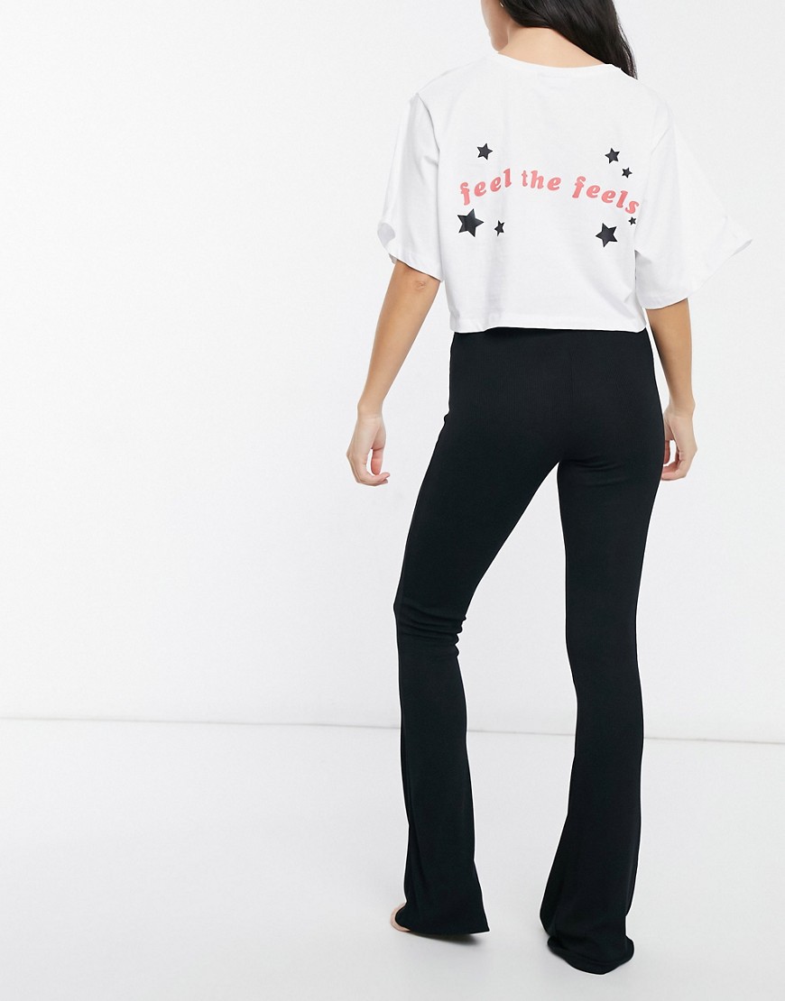 ASOS DESIGN 'Feel the feels' cropped tee and flared pants pajama set in white and black-Multi