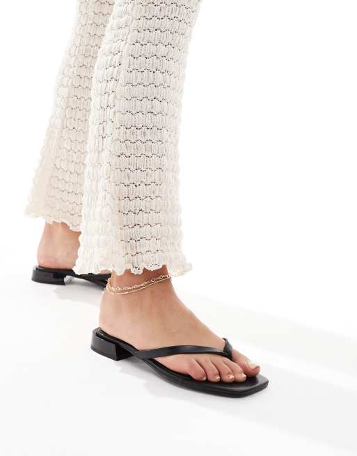 ASOS DESIGN Felicity skinny toe-thong flat sandals in black, 2 of 4