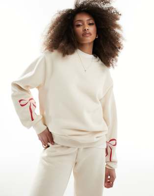 ASOS DESIGN - Felpa color crema con fiocchi in coordinato