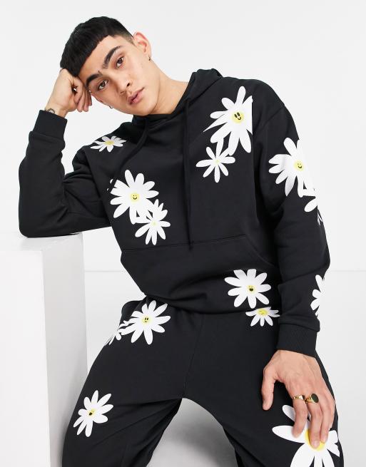 ASOS DESIGN - Felpa con cappuccio oversize nera con stampe di margherite in coordinato