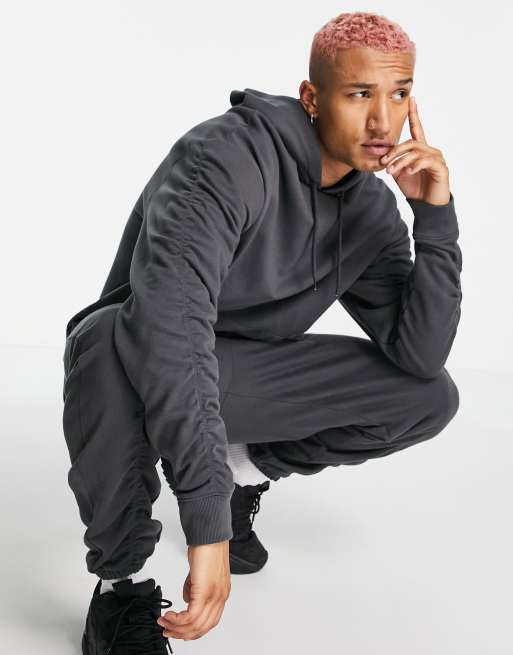 ASOS DESIGN - Tuta sportiva oversize con arricciatura nero slavato, 2 di 3