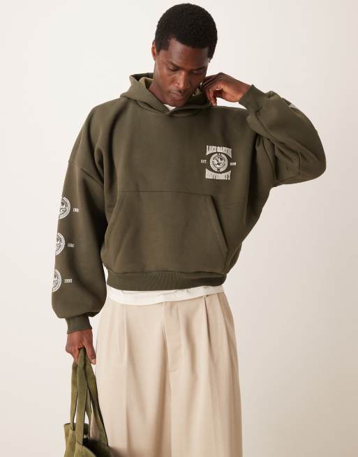 ASOS DESIGN - Felpa corta oversize verde con cappuccio, stampe e spalle scese