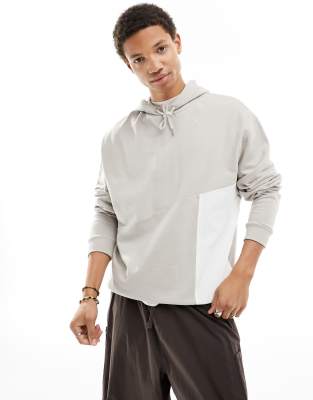 ASOS DESIGN - Felpa oversize beige con cappuccio e tasca in nylon