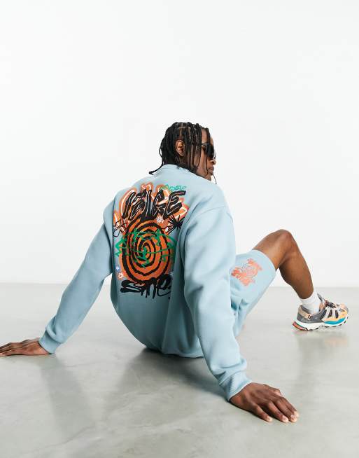 ASOS DESIGN - Felpa oversize blu con stampa stile skate sul retro in coordinato