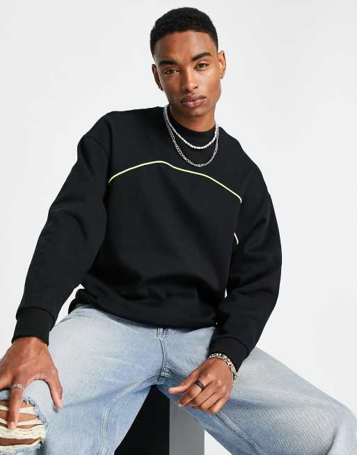 ASOS DESIGN - Felpa oversize nera con profilo fluo