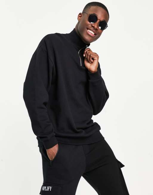 ASOS DESIGN - Felpa oversize nera con zip corta