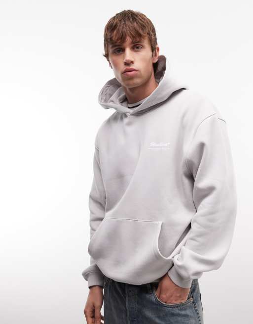 ASOS DESIGN - Felpa taglio comodo grigia con cappuccio e scritta