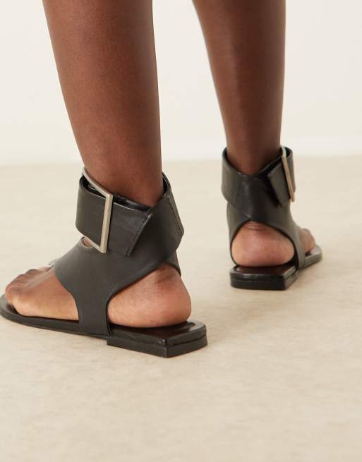 ASOS DESIGN Fernando leather sandals with metal toe loop in black