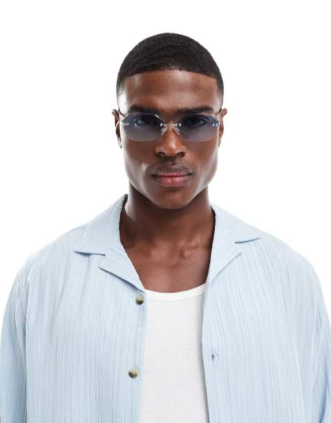 ASOS DESIGN festival curved rectangle rimless sunglasses with blue lens and metal silver frame - view 1