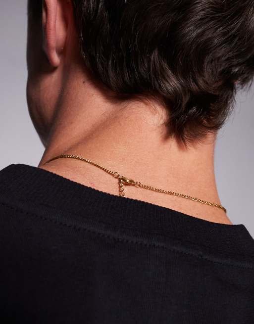 ASOS DESIGN waterproof stainless steel necklace with faux ruby stone pendant in gold tone