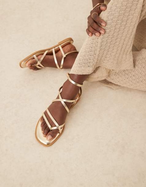 ASOS DESIGN Fierce strappy sandal in gold - view 1