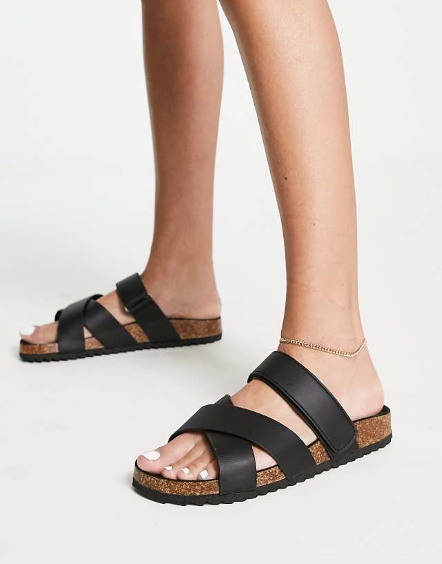 ASOS DESIGN Fiery cross strap flat sandals in black