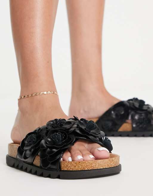 ASOS DESIGN Figgy cross strap floral flat sandals in black ASOS