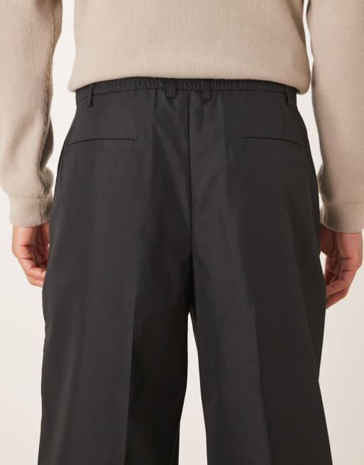 ASOS DESIGN – Figurbetonte Hose aus Funktionsstoff in Schwarz mit weitem Bein und elastischem Taillenbund, 4 von 5