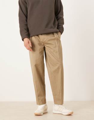 Figurbetonte, schmal zulaufende Oversize-Hose aus hochwertigem Leinenmix in Khaki mit Bundfalten-Grün Grün 52 Long