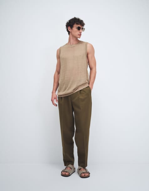 ASOS DESIGN – Figurbetonte, schmal zulaufende Oversize-Hose in Olivgrün mit Bundfalten - view 1