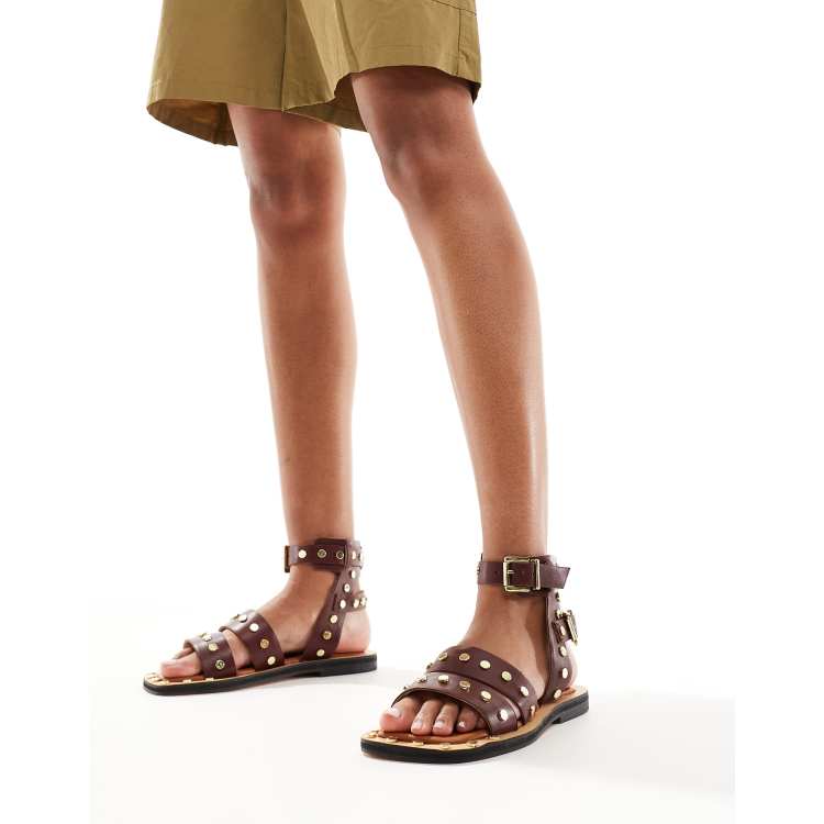 ASOS DESIGN Fiji leather studded flat sandals in burgundy