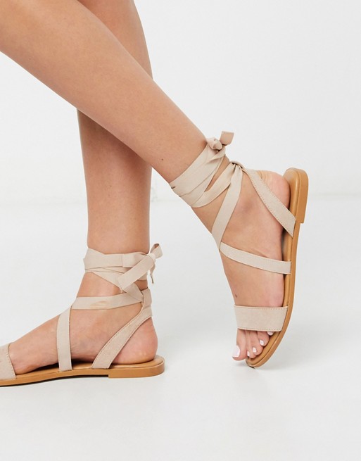 ASOS DESIGN Finland tie leg flat sandals in beige | ASOS