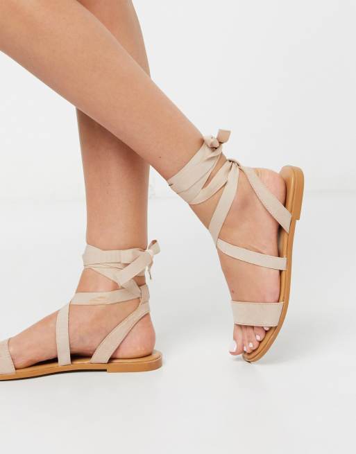 ASOS DESIGN Finland tie leg flat sandals in beige | ASOS