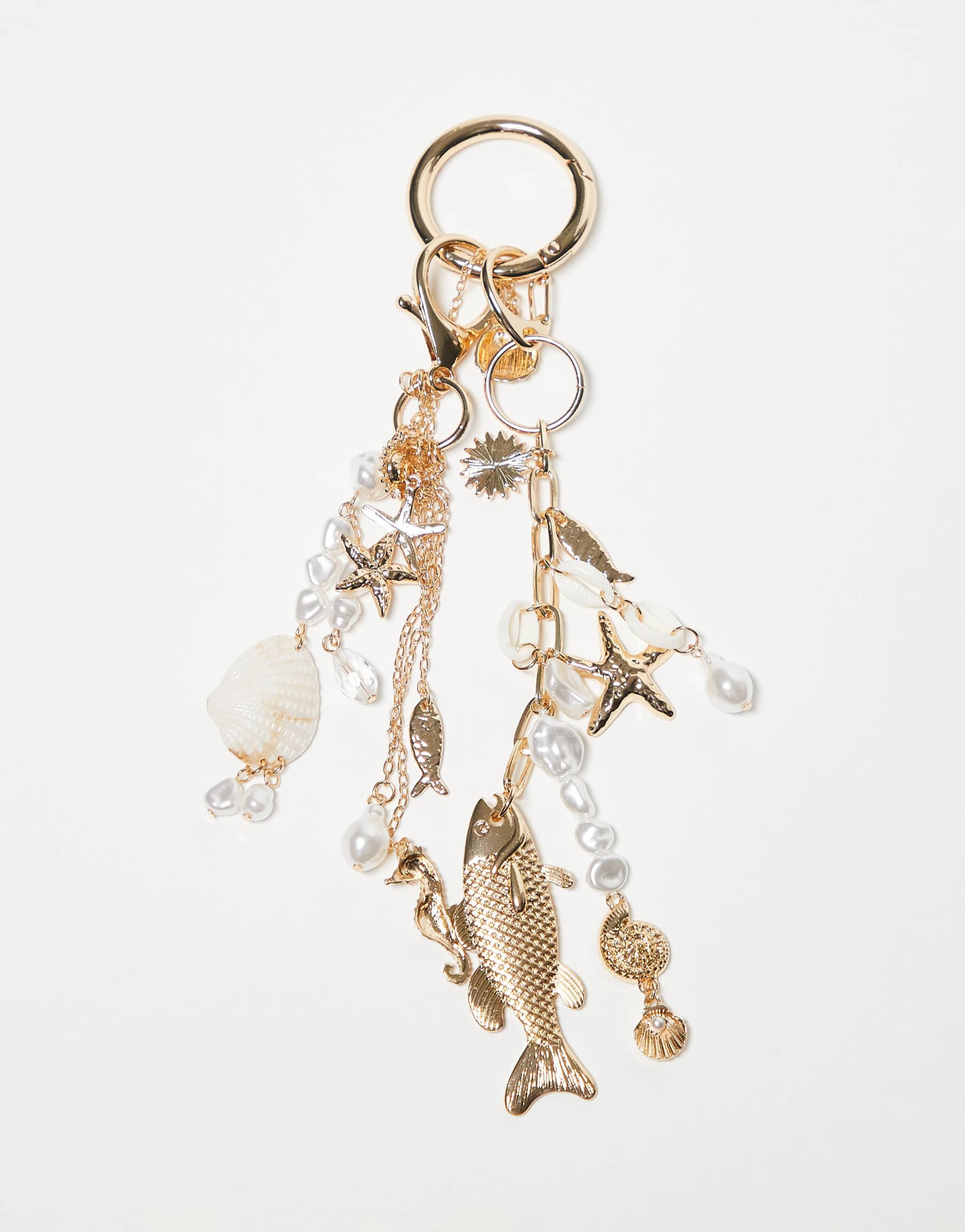 asos design fish & faux shell bag charm in gold