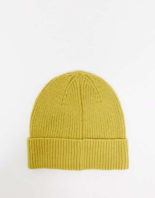 ASOS DESIGN fisherman rib beanie hat in polyester in mustard 