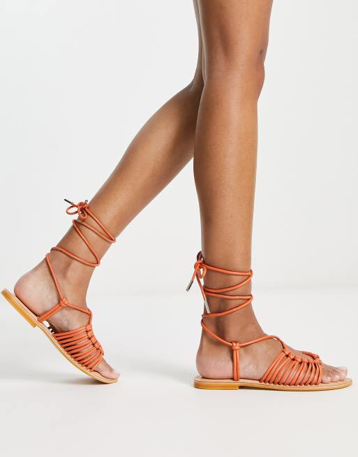 ASOS DESIGN Fizz leather knotted strappy flat sandal in orange ASOS