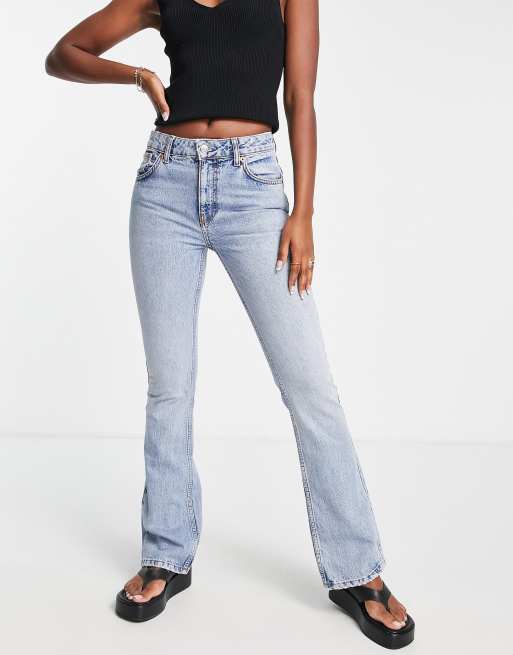 ASOS DESIGN low rise flared jeans with western pocket detail in dark blue