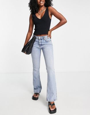 ASOS DESIGN low rise flared jeans with western pocket detail in