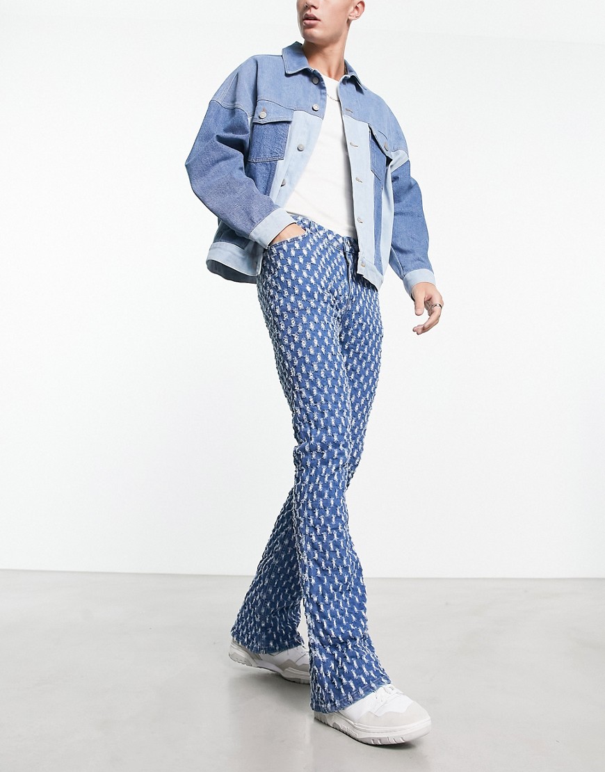 ASOS DESIGN flare jeans with all over distressing in blue
