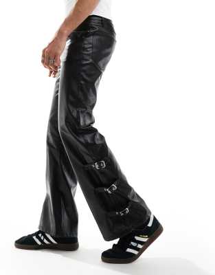 flare leather look pants in black with buckle hem detail