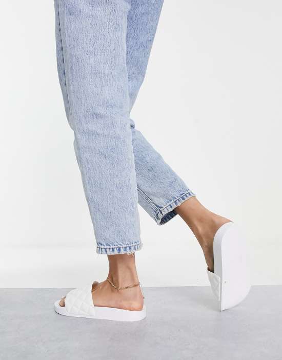 https://images.asos-media.com/products/asos-design-flare-quilted-sliders-in-white/201126446-2?$n_550w$&wid=550&fit=constrain