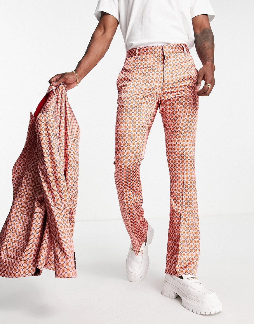ASOS DESIGN flare suit pants in red and pink retro geo print