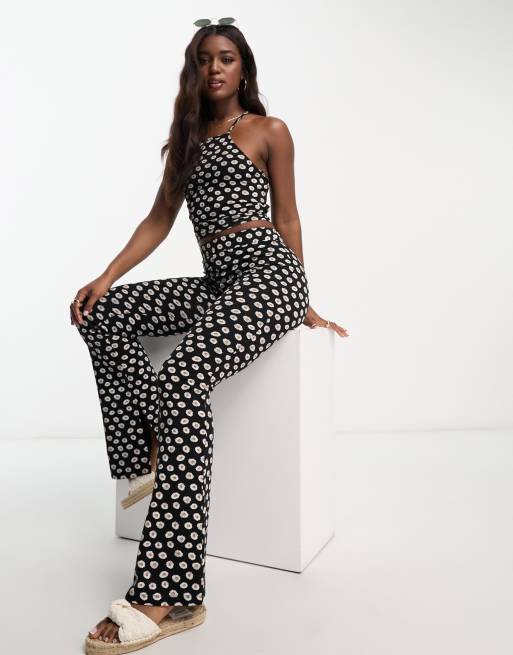 ASOS DESIGN flare trouser co-ord in black based daisy print