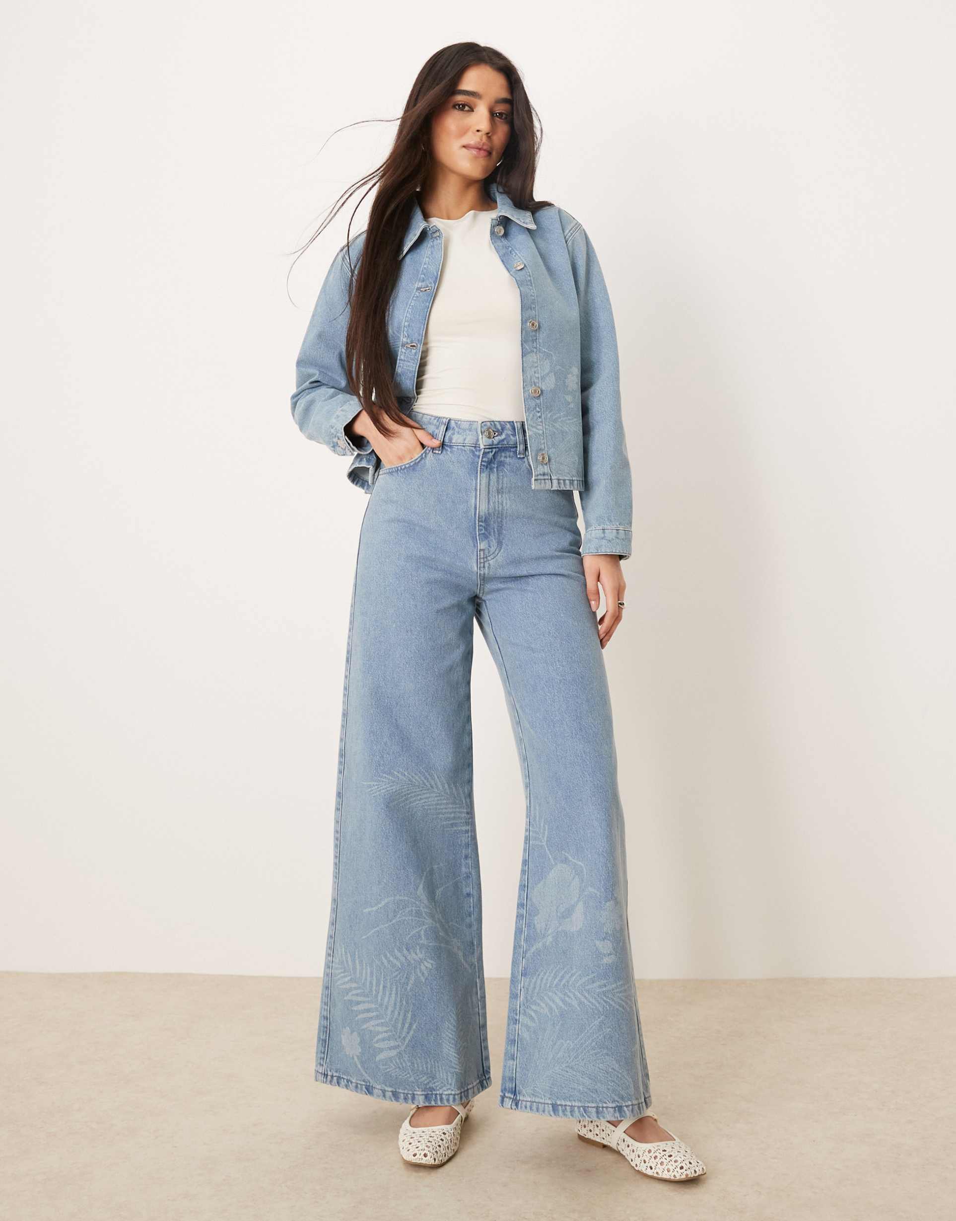 asos design flared 70s jeans with wildflower laser design
